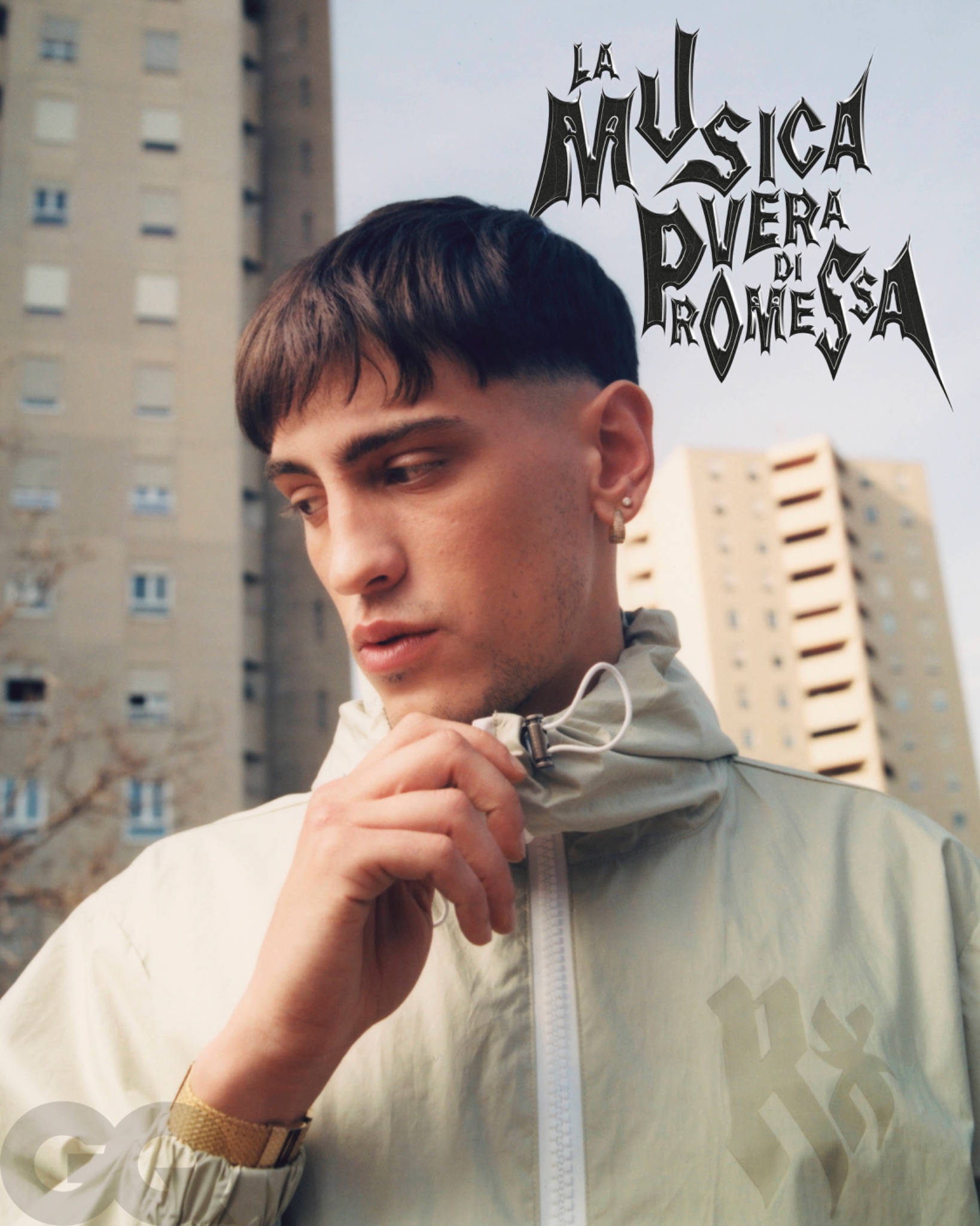 Editorial portrait of Promessa holding the collar of a light jacket, with tall residential buildings behind and headline lettering above.